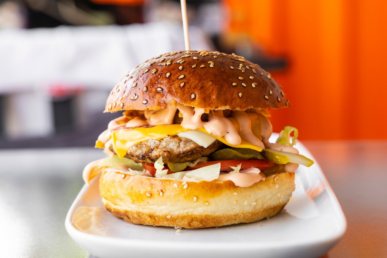 Burger on White Ceramic Plate